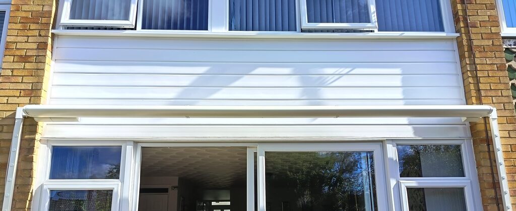 White Weinor Cassita II cassette retracted above sliding patio doors on a Headcorn house