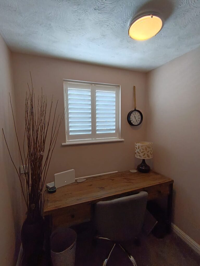 Super White hardwood shutters above a desk in a Tovil home office