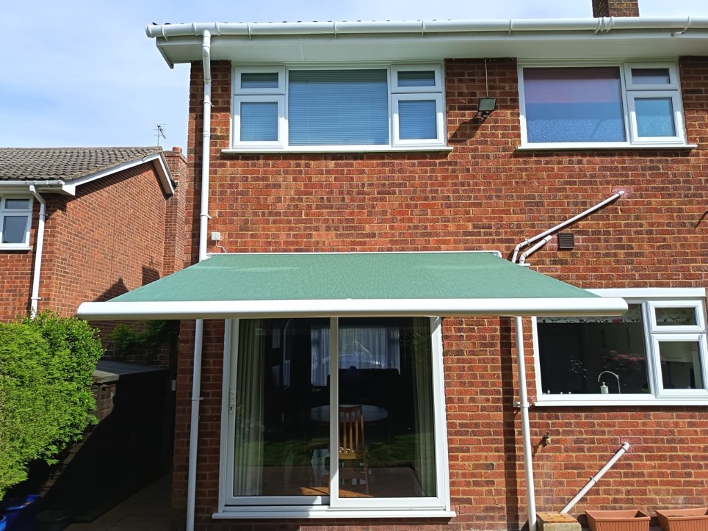 White Weinor Cassita II cassette awning on a red brick house in Loose, Kent