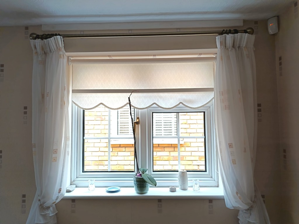 In-house roller blind with classic scalloped edge and decorative trim, West Malling
